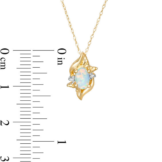 Oval Lab-Created Opal and Diamond Accent Flame Burst Pendant in 10K Gold