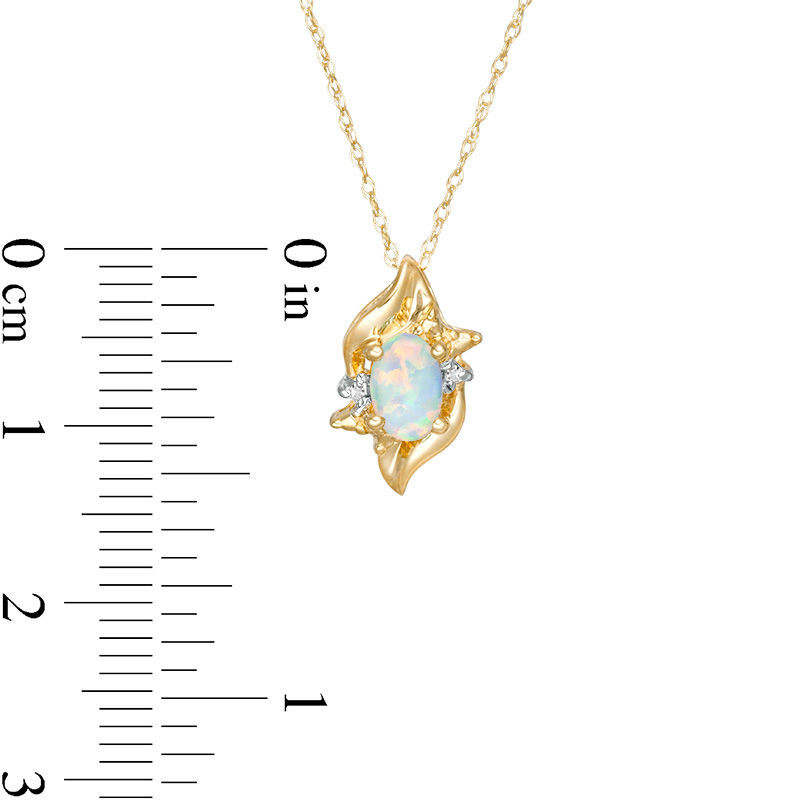 Oval Lab-Created Opal and Diamond Accent Flame Burst Pendant in 10K Gold