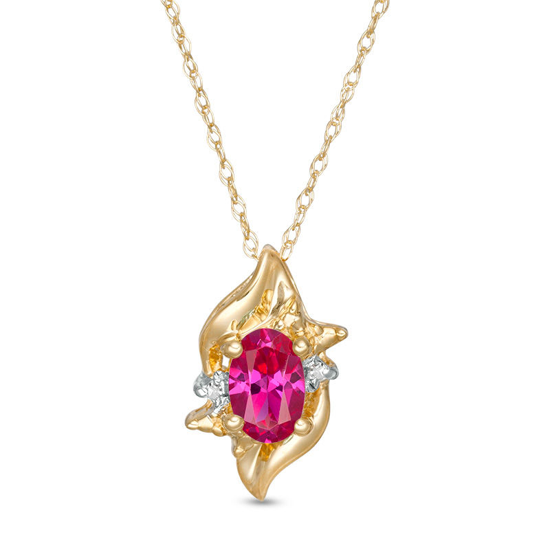 Oval Lab-Created Ruby and Diamond Accent Flame Burst Pendant in 10K Gold