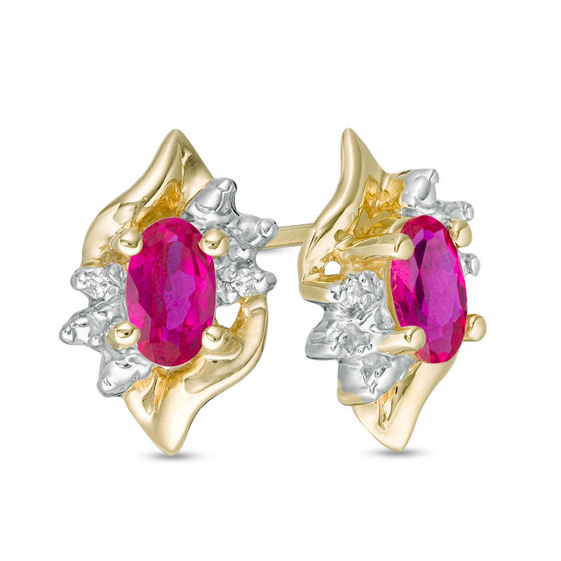 Oval Lab-Created Ruby and Diamond Accent Flame Burst Stud Earrings in 10K Gold