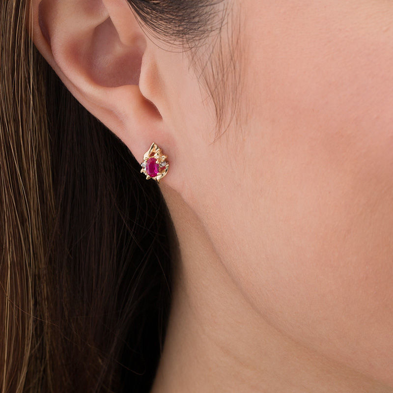 Oval Lab-Created Ruby and Diamond Accent Flame Burst Stud Earrings in 10K Gold
