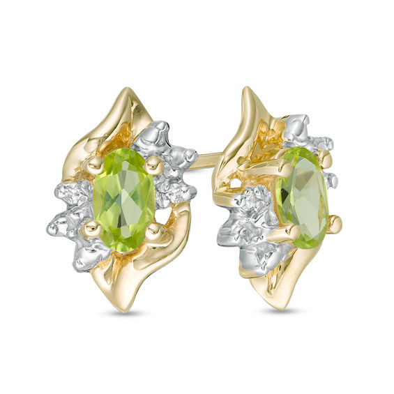 Oval Peridot and Diamond Accent Flame Burst Stud Earrings in 10K Gold Oval Peridot and Diamond Accent Flame Burst Stud Earrings in 10K Gold