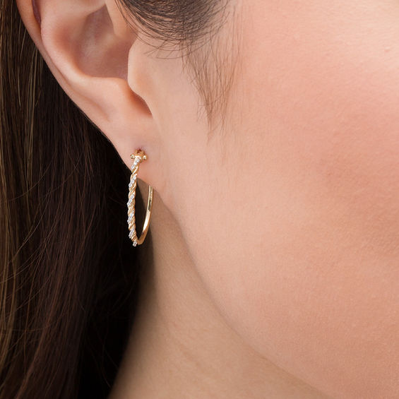 1/10 CT. T.w. Diamond Twist Oval Hoop Earrings in 10K Gold