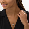 Thumbnail Image 2 of Elongated Oval Sky Blue Topaz and 1/6 CT. T. Diamond Frame Drop Pendant in 10K Rose Gold
