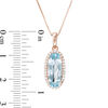 Thumbnail Image 3 of Elongated Oval Sky Blue Topaz and 1/6 CT. T. Diamond Frame Drop Pendant in 10K Rose Gold