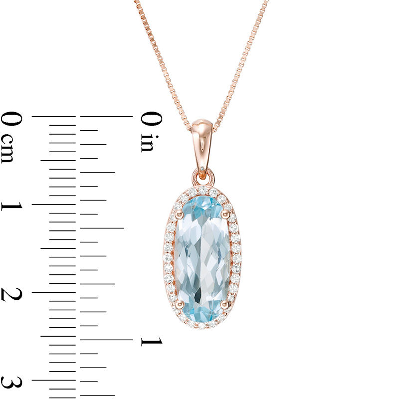 Main Image 3 of Elongated Oval Sky Blue Topaz and 1/6 CT. T. Diamond Frame Drop Pendant in 10K Rose Gold