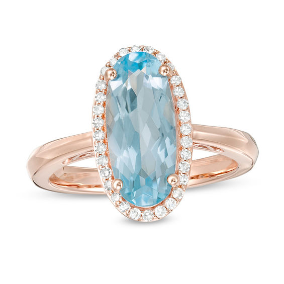 Elongated Oval Sky Blue Topaz and 1/6 CT. T.w. Diamond Frame Ring in 10K Rose Gold