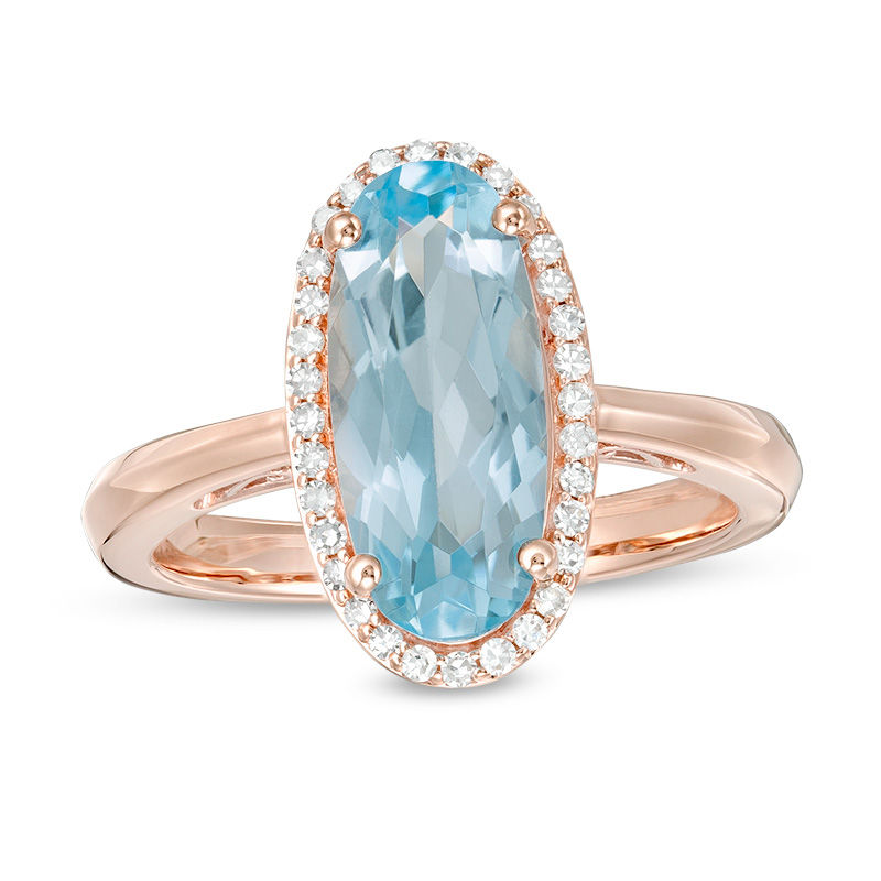 Main Image 1 of Elongated Oval Sky Blue Topaz and 1/6 CT. T.W. Diamond Frame Ring in 10K Rose Gold