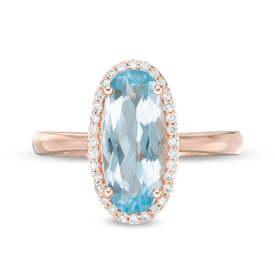 Elongated Oval Sky Blue Topaz and 1/6 CT. T.w. Diamond Frame Ring in 10K Rose Gold
