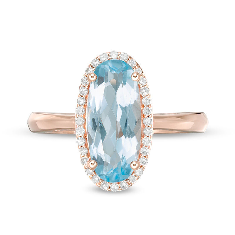 Main Image 4 of Elongated Oval Sky Blue Topaz and 1/6 CT. T.W. Diamond Frame Ring in 10K Rose Gold