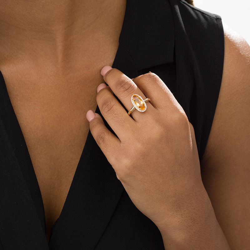 Main Image 2 of Elongated Oval Citrine and 1/6 CT. T.W. Diamond Frame Ring in 10K Gold