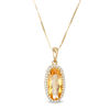 Thumbnail Image 1 of Elongated Oval Citrine and 1/6 CT. T.W. Diamond Frame Drop Pendant in 10K Gold