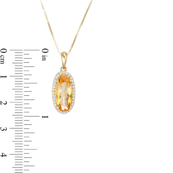 Elongated Oval Citrine and 1/6 CT. T.w. Diamond Frame Drop Pendant in 10K Gold