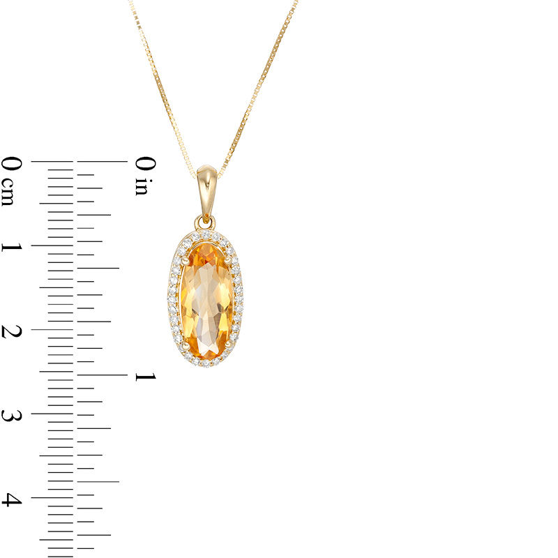 Main Image 3 of Elongated Oval Citrine and 1/6 CT. T.W. Diamond Frame Drop Pendant in 10K Gold