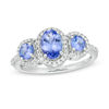 Thumbnail Image 0 of Oval Tanzanite and 1/5 CT. T.W. Diamond Frame Three Stone Ring in Sterling Silver