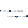 Thumbnail Image 3 of Oval Blue Sapphire and Diamond Accent Station Bracelet in 10K White Gold - 7.5"