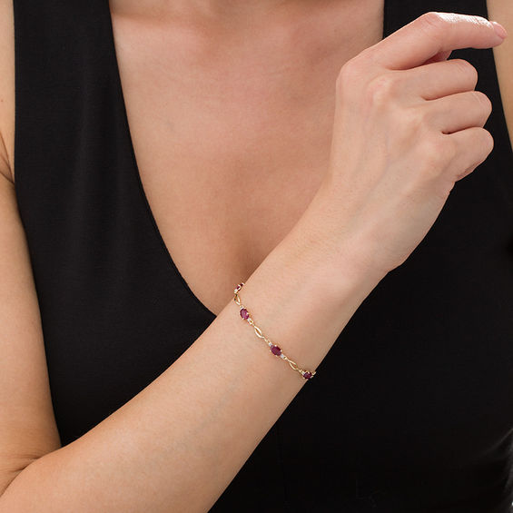Oval Ruby and Diamond Accent Station Bracelet in 10K Gold - 7.5"