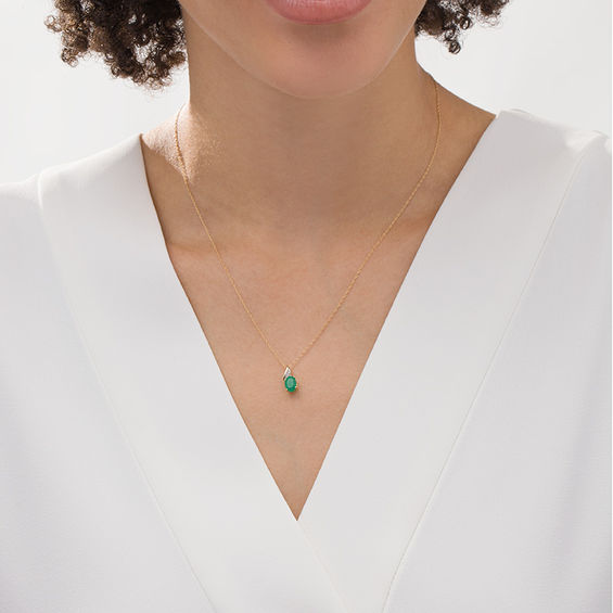 Oval Emerald and Diamond Accent Flame Pendant in 10K Gold
