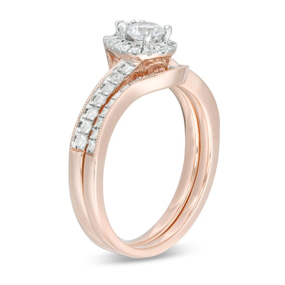 5/8 CT. T.W. Diamond Pear-Shaped Frame Vintage-Style Bridal Set in 10K Rose Gold 5/8 CT. T.W. Diamond Pear-Shaped Frame Vintage-Style Bridal Set in 10K Rose Gold