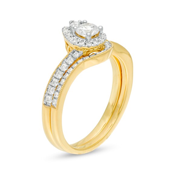 5/8 CT. T.W. Diamond Pear-Shaped Frame Vintage-Style Bridal Set in 10K Gold 5/8 CT. T.W. Diamond Pear-Shaped Frame Vintage-Style Bridal Set in 10K Gold