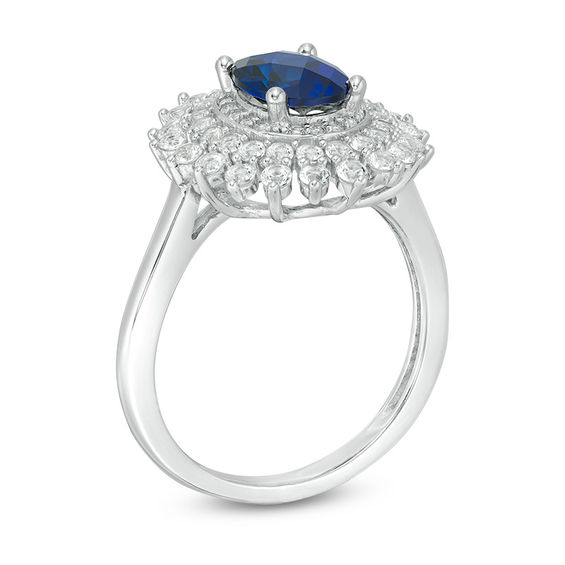Oval Blue Sapphire and 5/8 CT. T.w. Diamond Sunburst Frame Ring in 10K White Gold
