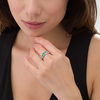 Thumbnail Image 1 of Lab-Created Emerald and White Sapphire Seven Stone Bypass Ring in Sterling Silver