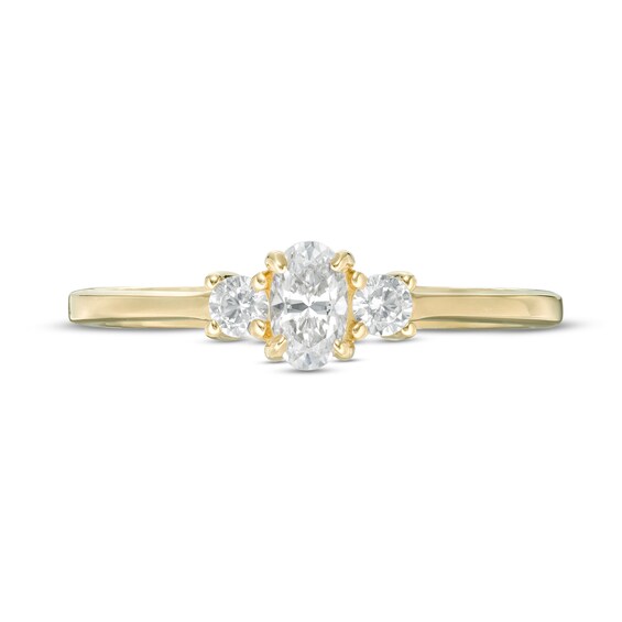 1/2 CT. T.w. Oval and Round Diamond Three Stone Engagement Ring in 14K Gold