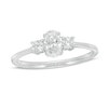 Thumbnail Image 1 of 5/8 CT. T.W. Oval and Round Diamond Three Stone Engagement Ring in 14K White Gold