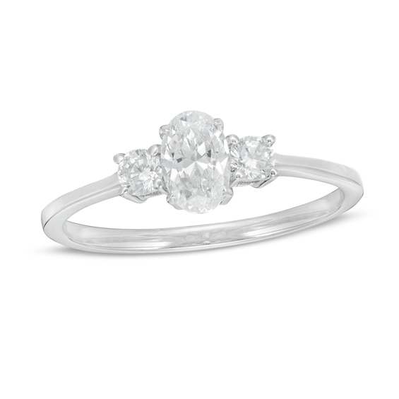 CT. T.w. Oval and Round Diamond Three Stone Engagement Ring in 14K Gold