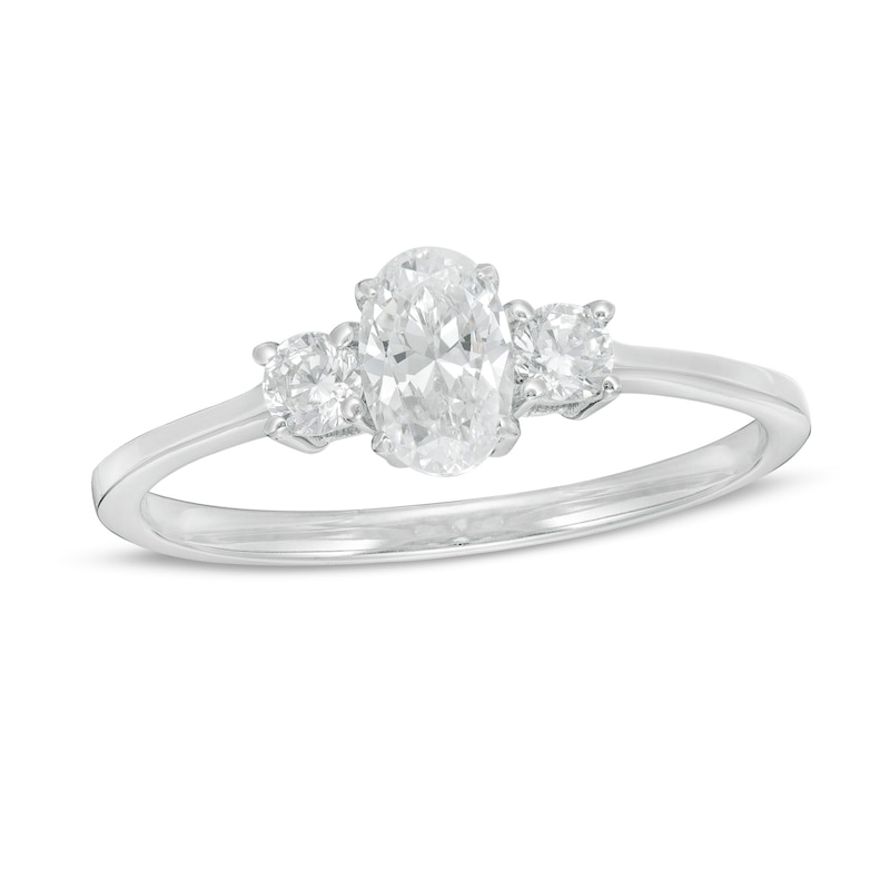 5/8 CT. T.W. Oval and Round Diamond Three Stone Engagement Ring in 14K White Gold