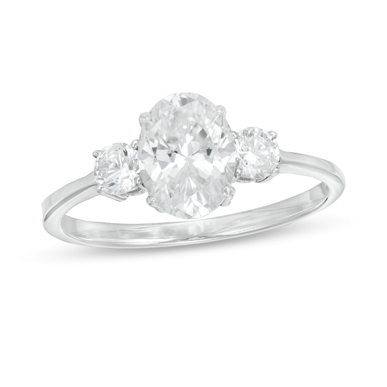 1-1/4 CT. T.w. Oval and Round Diamond Three Stone Engagement Ring in 14K White Gold