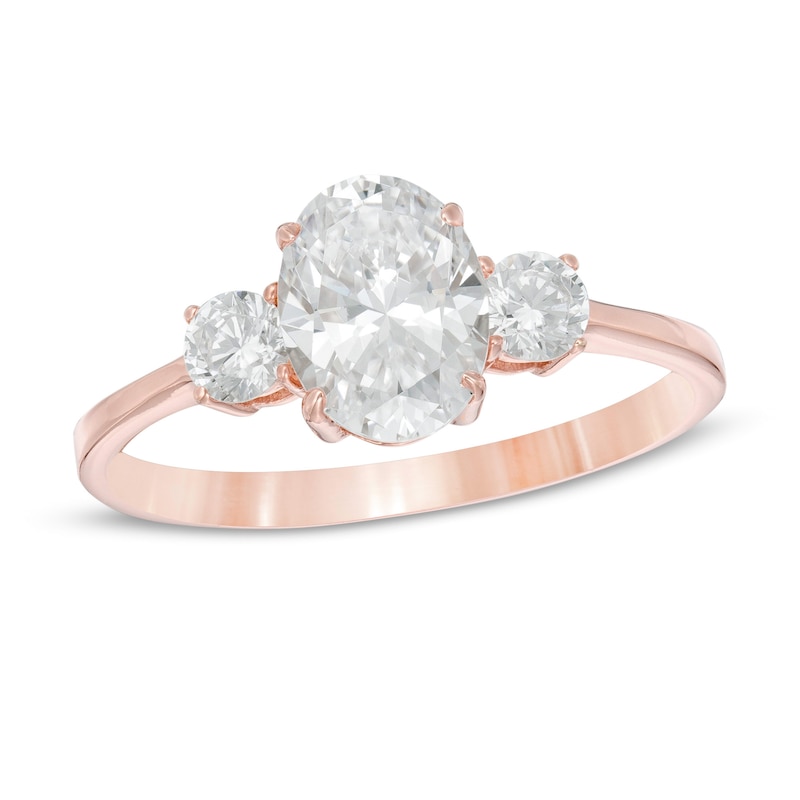 Main Image 1 of 1-1/4 CT. T.W. Oval and Round Diamond Three Stone Engagement Ring in 14K Rose Gold