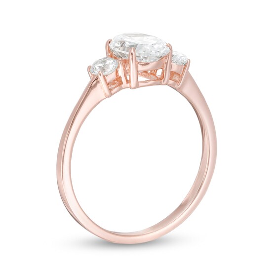 1-1/4 CT. T.w. Oval and Round Diamond Three Stone Engagement Ring in 14K Rose Gold