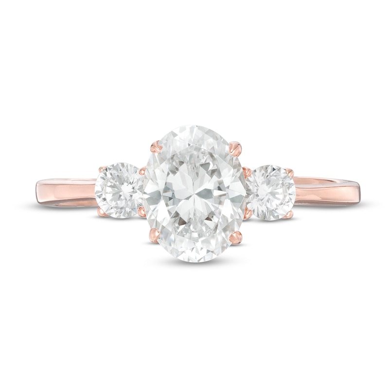 Main Image 4 of 1-1/4 CT. T.W. Oval and Round Diamond Three Stone Engagement Ring in 14K Rose Gold