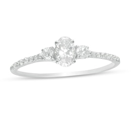 5/8 CT. T.W. Oval and Round Diamond Three Stone Engagement Ring in 14K White Gold