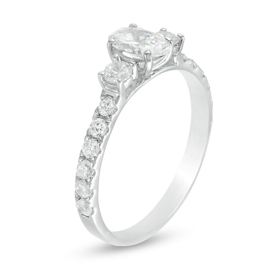 1-1/6 CT. T.w. Diamond Three Stone Engagement Ring in 14K White Gold