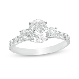 1-3/4 CT. T.W. Oval and Round Diamond Three Stone Engagement Ring in 14K White Gold