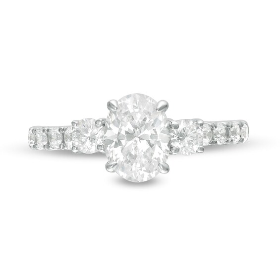1-3/4 CT. T.w. Oval and Round Diamond Three Stone Engagement Ring in 14K White Gold