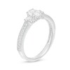 7/8 CT. T.W. Oval and Round Diamond Three Stone Vintage-Style Engagement Ring in 14K White Gold
