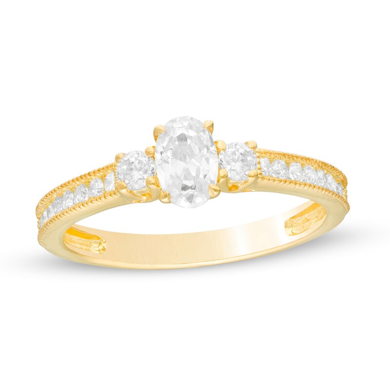 7/8 CT. T.W. Oval and Round Diamond Three Stone Engagement Ring in 14K Gold