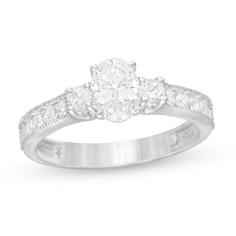 1-1/6 CT. T.W. Oval and Round Diamond Three Stone Engagement Ring in 14K White Gold