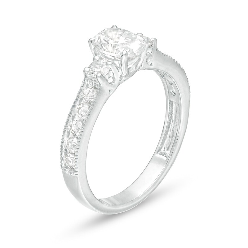 1-1/6 CT. T.W. Oval and Round Diamond Three Stone Engagement Ring in 14K White Gold