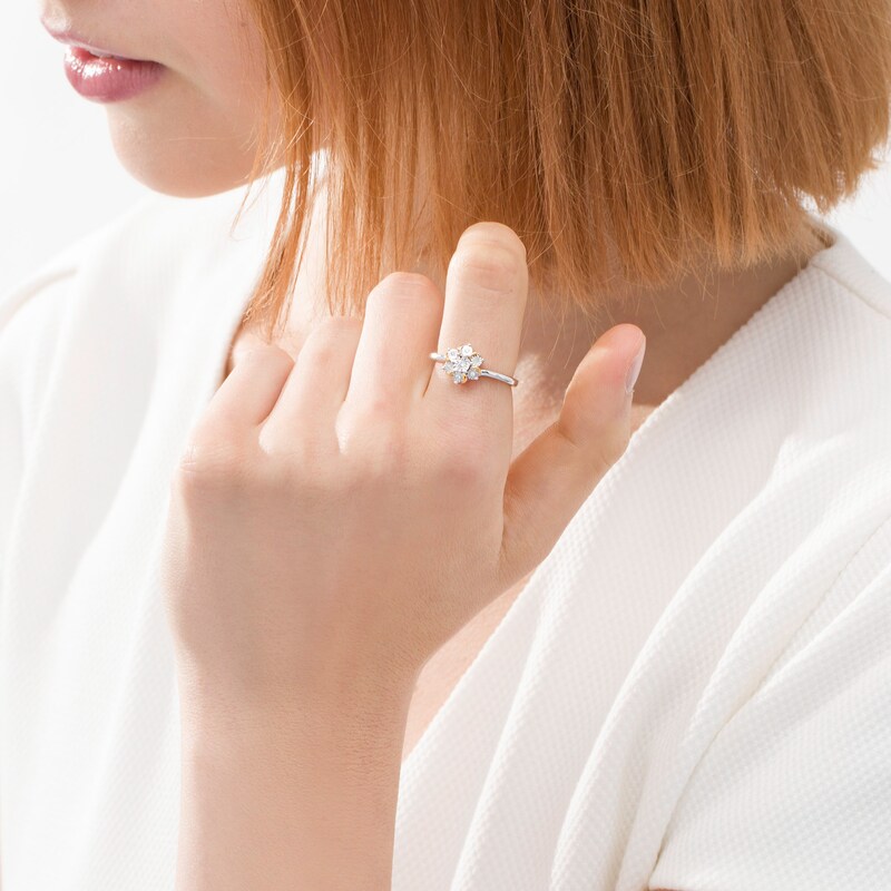 Main Image 2 of 1/20 CT. T.W. Diamond Curved Flower Ring in Sterling Silver and 14K Gold Plate