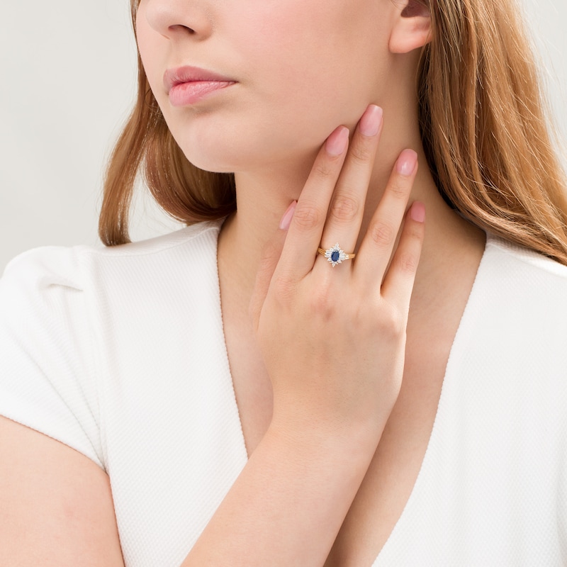 Oval Blue Sapphire and 1/3 CT. T.W. Diamond Starburst Frame Ribbed Shank Ring in 14K Gold