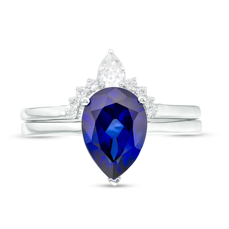 Pear-Shaped Lab-Created Blue Sapphire, White Topaz and 1/20 CT. T.W. Diamond Crown Bridal Set in 10K White Gold