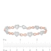 Thumbnail Image 4 of 1/10 CT. T.W. Diamond Alternating Heart and Infinity Link Bracelet in Sterling Silver and 10K Rose Gold - 7.25"