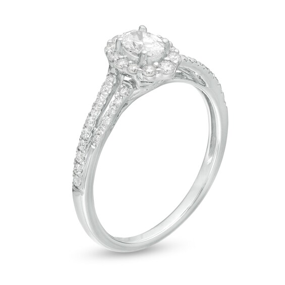 1/2 CT. T.w. Oval Diamond Frame Split Shank Engagement Ring in 10K White Gold