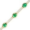 Thumbnail Image 0 of Oval Lab-Created Emerald and White Sapphire Station Bar Bracelet in Sterling Silver with 14K Gold Plate - 7.25"