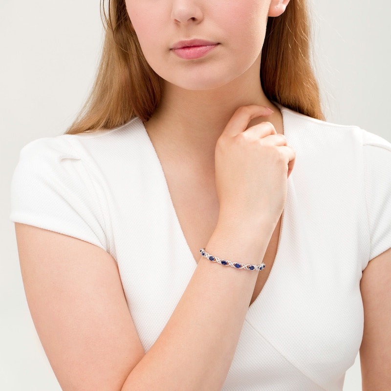 Oval Lab-Created Blue Sapphire and 1/4 CT. T.W. Diamond Double Infinity Bracelet in Sterling Silver - 7.25"