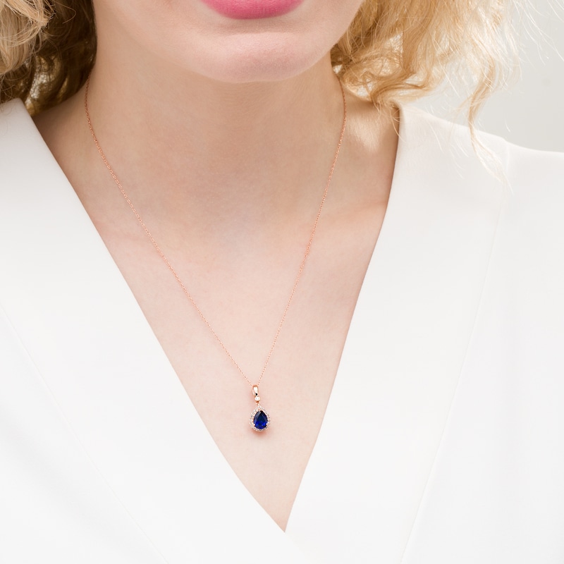 Main Image 2 of Pear-Shaped Lab-Created Blue Sapphire and 1/10 CT. T.W. Diamond Frame Pendant in 10K Rose Gold